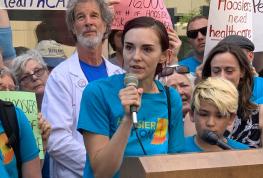 Woman speaking at rally